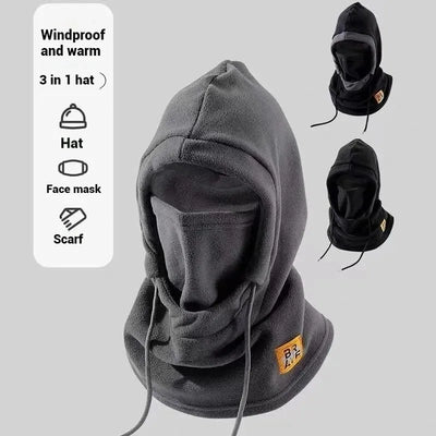 A gray 3-in-1 winter hat, mask, and neck warmer balaclava with a tag showing it is windproof and warm.